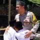 Bhabinkamtibmas Aipda Minanto Sisihkan Gaji untuk Sekolah Gratis Keluarga Kurang Mampu di Way Kanan