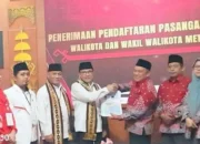 Pasangan Petahana Wahdi – Qomaru Resmi Daftar ke KPU Metro, Diusung Koalisi Besar