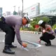 Hati-Hati, Polresta Bandar Lampung Tandai Jalan Rusak dan Berlubang Pakai Cat Semprot